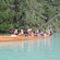A group of people taking pictures from a canoe on Chilkoot Lake
